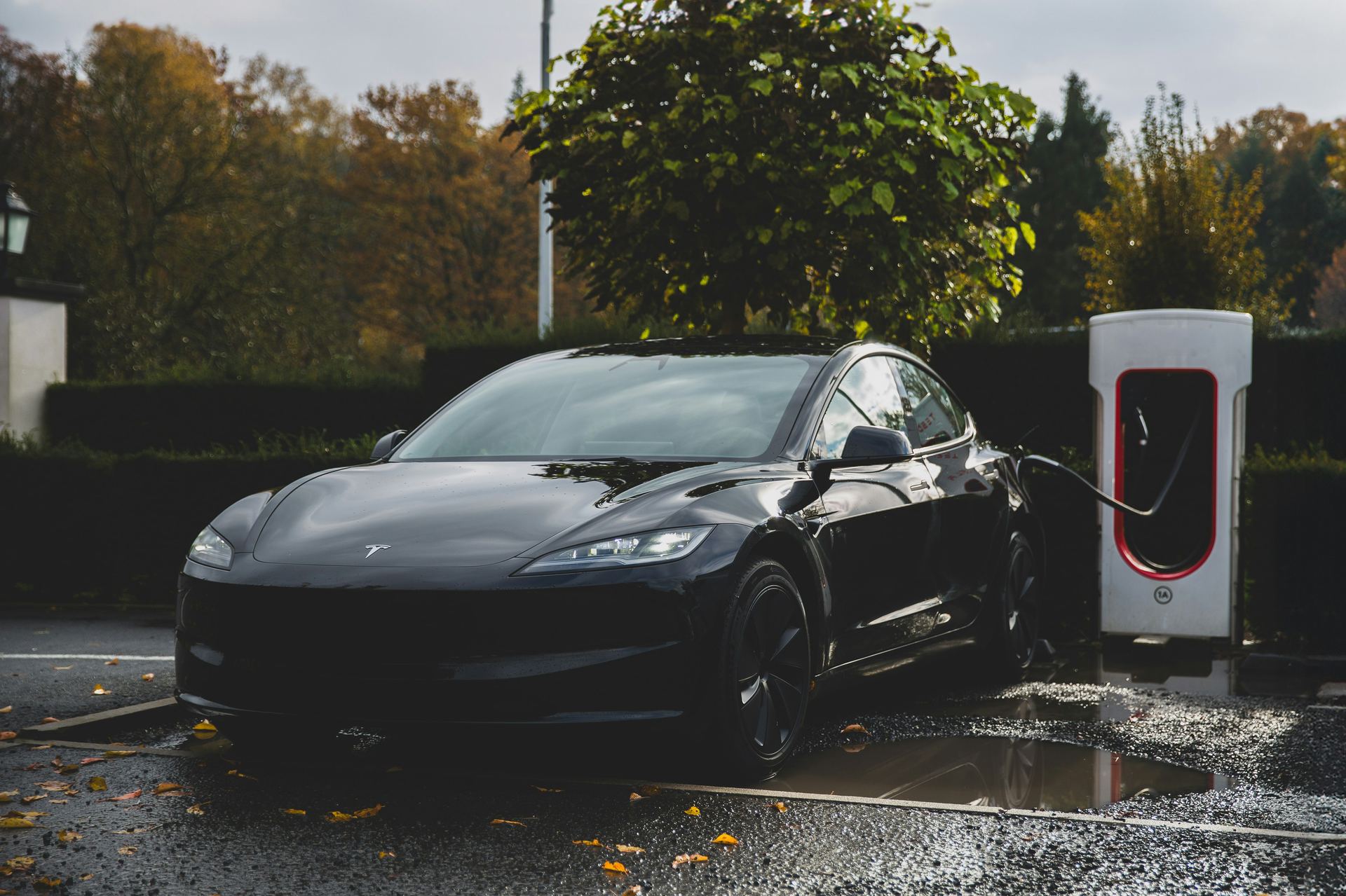 DC fast charger installed at a commercial site at night