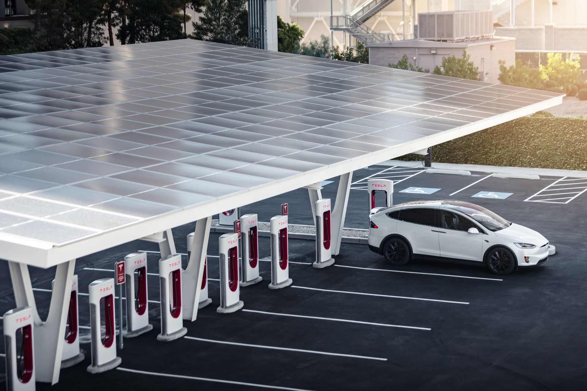 Tesla Supercharger site under a solar canopy